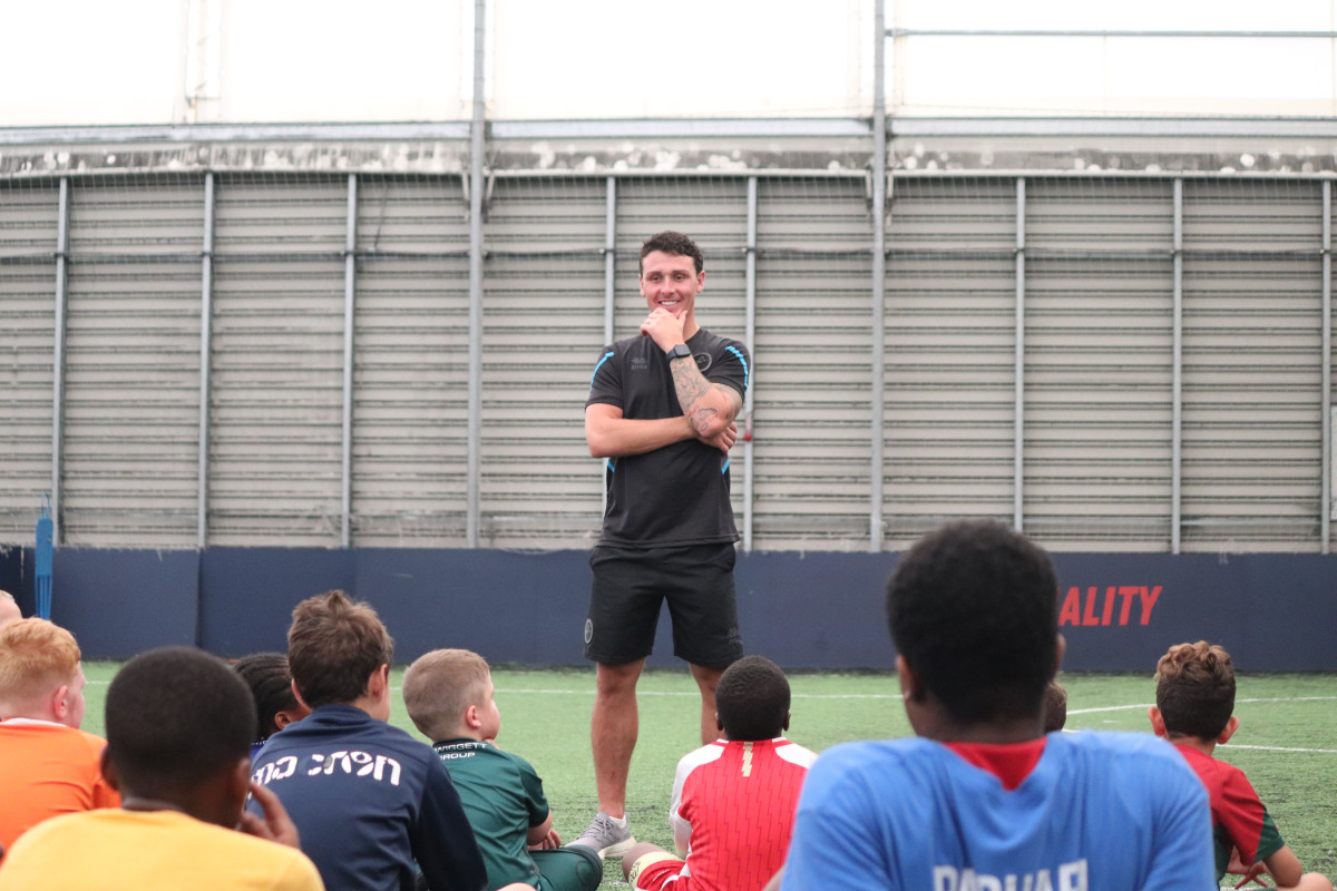 Millwall FC First-Team Player Danny McNamara visited Millwall Community Trust’s (MCT) Holiday, Activity and Food (HAF) Camps at The Lions Centre this afternoon